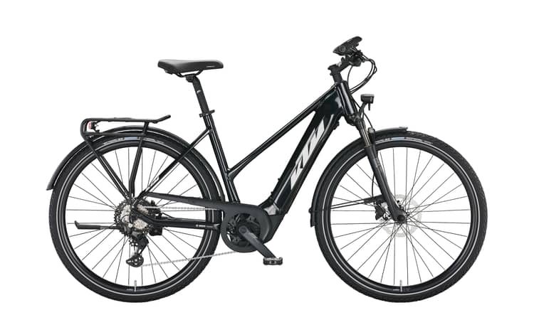 Modern KTM Macina Sport 630 e-bike in silver and black with orange accents, efficient design, and mounted rear rack.