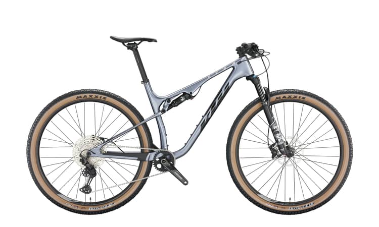 Modern metallic grey and black Scarp Elite mountain bike with full suspension and tan sidewall tires.